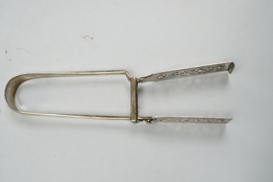 A pair of Victorian silver asparagus tongs, Elizabeth & John Eaton, London, 1859, 25cm, 7.1oz. Condition - fair to good